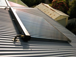 Topside of a solar hot water system is shown in the image