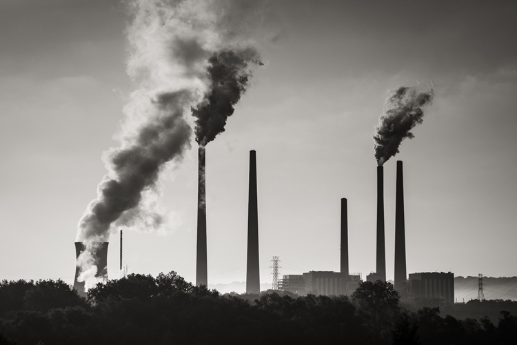 An image of smoke coming from the factory is shown