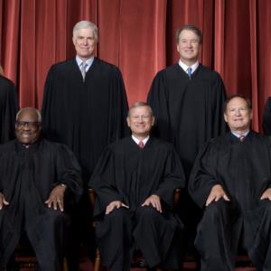 Group of judges in black robes.