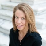 Portrait of smiling woman on marble steps