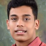 Portrait of person smiling in red shirt
