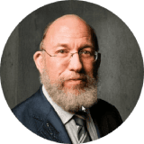 Bearded man portrait wearing glasses and suit